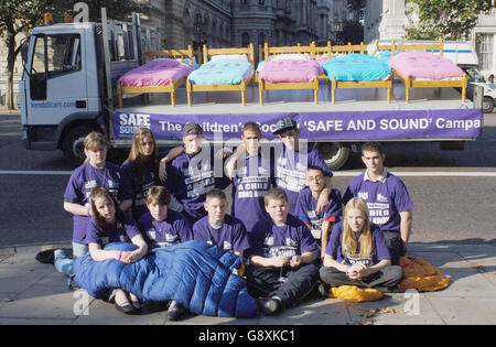 Former runaways nearr 10 Downing Street, today Monday October 10th 2005, with one of two lorry's carrying beds to publicise new research by the Children's Society revealing that there are only 10 beds available for the estimated 100, 000 runaways in the UK each year Watch For PA Story SOCIAL Children. PRESS ASSOCIATION PHOTO. PHOTO CREDIT SHOULD READ Fiona Hanson/PA Stock Photo