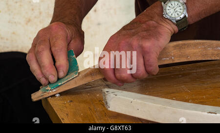 hands of a carpenter working on his latest creation Stock Photo
