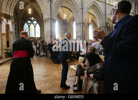 Sadiq Khan receives a standing ovation during the signing ceremony for the newly elected Mayor of London, in Southwark Cathedral, London. Stock Photo
