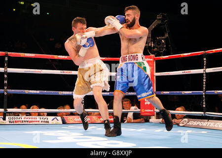 Jono Carroll (right) and Jordan Ellinson during the Super-Featherweight contest at the Manchester Arena. Stock Photo