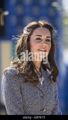 The Duchess of Cambridge views Hampton Court's recently unveiled Magic Garden, marking the official opening of the palace's new children's play area. Stock Photo
