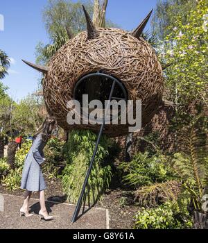 The Duchess of Cambridge looks at a 'Dragons nest' play area as she views Hampton Court's Magic Garden, marking the official opening of the palace's new children's play area. Stock Photo