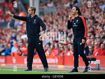 *ALTERNATE CROP* Liverpool manager Jurgen Klopp (left) reacts on the touchline during the Barclays Premier League match at Anfield, Liverpool. Stock Photo