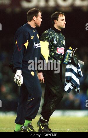 L-R; Brad Friedel, Liverpool walks off with his fellow USA goalkeeper Kasey Keller, Leicester City Stock Photo