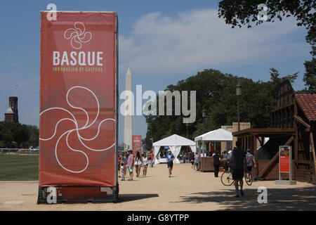 Washington, DC, USA. 30th June, 2016. The 2016 Smithsonian Folklife Festival, whose themes are ''Basque: Innovation by Culture'' and ''Sounds of California'' this year, is taking place on the National Mall in Washington, DC. Seen here is a large banner on the National Mall announcing the Basque theme, with the Washington Monument in the background. © Evan Golub/ZUMA Wire/Alamy Live News Stock Photo