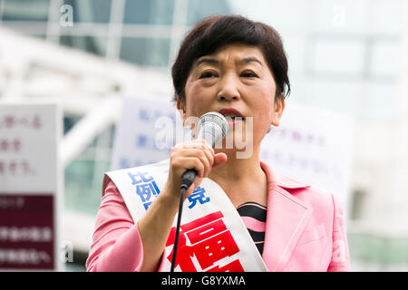 Mizuho Fukushima, Member of the House of Councillors and Social Democratic Party candidate for next House of Councillors elections, campaigns outside Shinjuku Station on July 1, 2016, Tokyo, Japan. Fukushima and the Social Democratic Party, along with the with the Democratic Party and the Japanese Communist Party, are calling on the public to participate in the next House of Councillors elections to try to stop the Liberal Democratic Party of Prime Minister Shinzo Abe from returning a majority. This is the first time that young voters (18 and 19 year-olds) will be allowed to take part in the e Stock Photo