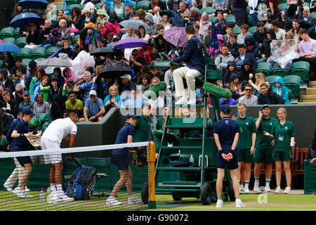 London, UK. 1st July, 2016.   All England Lawn Tennis and Croquet Club, London, England. The Wimbledon Tennis Championships Day Five. Rain drives the players off Court 2 before a game can be completed in the match between number 15 seed, Nick Kyrgios (AUS) and Dustin Brown (GER). Credit:  Action Plus Sports Images/Alamy Live News Stock Photo