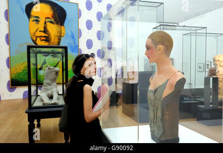 Berlin, Germany. 1st July, 2016. Visitors looking at the exhibition 'Das Kapital. Schuld - Territorium - Utopie' (lit. 'The Capital. Fault - Territory - Utopia' with works of numerous contemporary artists at the Museum der Gegenwart at Hamburger Bahnhof in Berlin, Germany, 1 July 2016. PHOTO: WOLFGANG KUMM/dpa/Alamy Live News Stock Photo