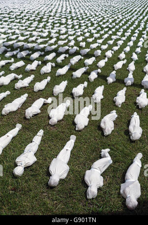 Shrouds of the Somme by artist Rob Heard on the 100th anniversary of the first day of the Battle of the Somme. Each of the 19,240 soldiers who died during the first day of battle are represented by a hand crafted 12 inch figure, wrapped and bound in a hand-stitched shroud and arranged in rows on the ground. Stock Photo