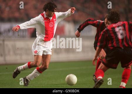 Soccer - UEFA Cup Quarter Final First Leg - Ajax v Spartak Moscow. Ajax's Dani (left) takes on the Spartak Moscow defence Stock Photo