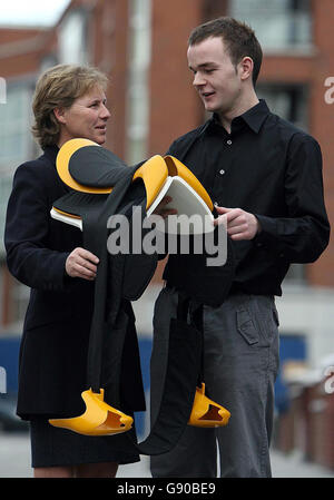 Martin Ryan, 22, and Ireland's leading event rider Sue Shortt hold his revolutionary horse saddle, in Dublin, Thursday November 10, 2005, which has won the 2005 Dyson Design Award. The saddle is machine washable and more comfortable for the horse and rider. Watch for PA Story CONSUMER Dyson Ireland. PRESS ASSOCIATION Photo. Photo credit should read: Niall Carson/PA Stock Photo