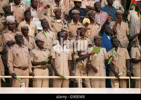 Soccer - African Nations Cup - Burkina Faso/Guinea. Soldiers watch the game Stock Photo