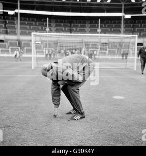 West Germany manager Helmut Schoen inspects a rain soaked Wembley pitch the day before the World Cup final against England Stock Photo