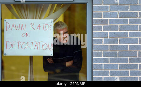 SSP party member Joe Eyre looks through a window of an Immigration Office in Brand Street, Glasgow, Wednesday, November 2, 2005. Scottish Socialist Tommy Sheridan and Nationalist stage a pro-asylum protest inside the Immigration Office. See PA Story SCOTLAND Protest. PRESS ASSOCIATION PHOTO. PHOTO CREDIT SHOULD READ Danny Lawson/PA Stock Photo