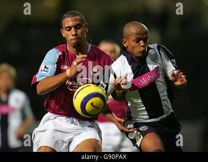 Soccer - FA Barclays Premiership - West Ham United v West Bromwich Albion - Upton Park. West Ham United's Anton Ferdinand (l) battles with West Bromwich Albion's Robert Earnshaw Stock Photo