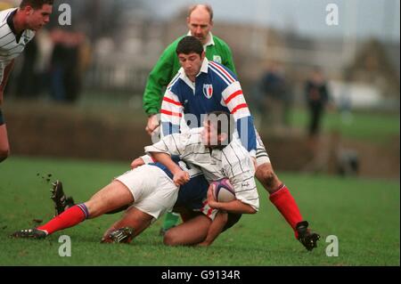 Scotland's Scott Murray (R) is tackled by France's Aubin Hueber (L) and Marc Raynaud (Top) Stock Photo