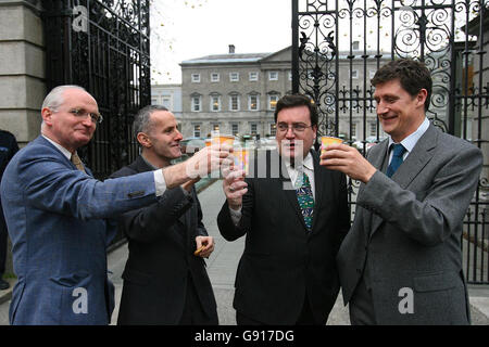 Green Party TD's l-r John Gormley, Ciaran Cuffe,Dan Boyle and Eamon Ryan toasting outside Leinster House Dublin Nov 23 2005 having a cup of Fair Trade Tea and Biscuits.The Young Greens were launching 'Fair Trade Nation' calling on all State Organisations to use Fair Trade Products. See PA Story POLITICS Free Trade PRESS ASSOCIATION PHOTOS Photo credit should read Julien Behal./PA Stock Photo