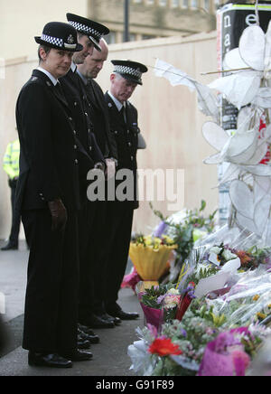 Chief Supt Sarah Brown looks at flowers left at the scene Monday 21st November 2005, where PC Sharon Beshenivsky was shot during an armed robbery in Bradford on Friday. Pc Beshenivsky, 38, who had three children and two stepchildren, was killed on her youngest daughter Lydia's fourth birthday as she arrived at the raid in a travel agent's shop on Morley Street, in Bradford city centre. See PA Story POLICE Officer. PRESS ASSOCIATION Photo. Photo credit should read: Martin Rickett/PA Stock Photo