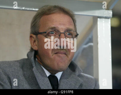 Palermo's new coach Giuseppe Papadopulo wears a soccer scarf during his  presentation in the Palermo soccer team headquarters Monday, Jan. 30, 2006.  Papadopulo was hired to replace Luigi Del Neri as coach