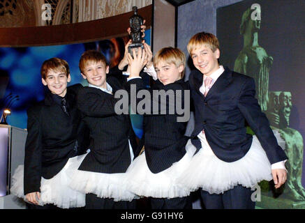 Cast members (left-right) Leon Cooke, George McGuire, Liam Mower and James Lomas as Billy Elliott wins Best Musical on Monday 28 November 2005 at the 51st Evening Standard Theatre awards held at the Savoy Hotel in central London. See PA story SHOWBIZ Awards. PRESS ASSOCIATION Photo. Photo Credit should read: Steve Parsons/PA. Stock Photo