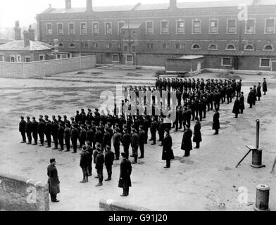 Library file, dated 1911: A parade by young inmates at Feltham Borstal institution, West London: A proposal to reinvent the Borstal was outlined by a Government quango today. The Youth Justice Board (YJB), which overseas the punishment of young criminals in England and Wales, is to press for a change in the law so that less serious offenders could go to residential special schools, open children's homes and 'therapeutic communities'. See PA story POLITICS Borstal. PRESS ASSOCIATION photo. Photo Credit should read: PA/PA. Unique Reference No. 1389984 Stock Photo