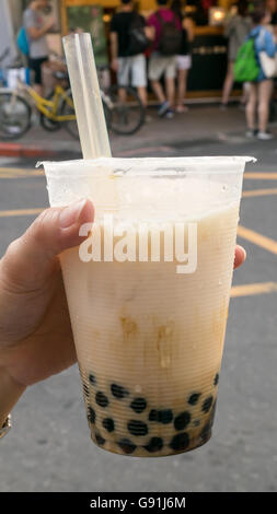 The tasty Taiwanese bubble tea drink (pearl milk tea) at food street market in Taipei, Taiwan. Stock Photo