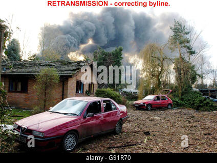 RETRANSMISSION - correcting byline. Damage caused to vehicles and property near the Buncefield oil depot in Hemel Hempstead, Hertfordshire, Tuesday December 13, 2005, which has been burning for more than 48 hours. Hertfordshire Police Assistant Chief Constable Robert Beckley said there was 'real optimism' that the inferno would be extinguished during the day, with some in the fire service confident it would be over before this afternoon. See PA story BLAST Explosion. PRESS ASSOCIATION Photo. Photo credit should read: Chris Radburn / PA. Stock Photo