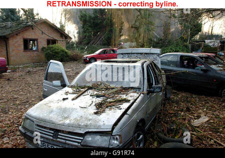 RETRANSMISSION - correcting byline. Damage caused to vehicles and property near the Buncefield oil depot in Hemel Hempstead, Hertfordshire, Tuesday December 13, 2005, which has been burning for more than 48 hours. Hertfordshire Police Assistant Chief Constable Robert Beckley said there was 'real optimism' that the inferno would be extinguished during the day, with some in the fire service confident it would be over before this afternoon. See PA story BLAST Explosion. PRESS ASSOCIATION Photo. Photo credit should read: Chris Radburn / PA. Stock Photo