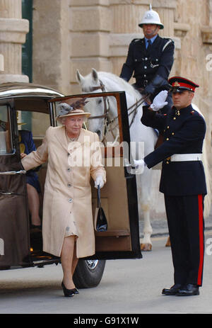 Queen Elizabeth II arrives at St Georges Square, Valletta for a four day Royal visit to Malta, on Wednesday November 23rd 2005, saluted by a Guard of Honour from the Armed Forces of Malta and a mounted policeman See PA Story ROYAL Malta PRESS ASSOCIATION PHOTO Photo credit should read Fiona Hanson/PA Stock Photo