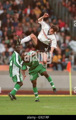 Soccer - Friendly - Germany v Nigeria. Germany's Dietmar Hamann (T) goes in high agaist Nigeria's Augustine Okocha (B) Stock Photo