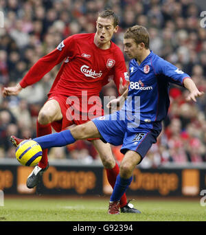 Liverpool's Peter Crouch (L) battles for the ball with Middlesbrough's James Morrison during the Barclays Premiership match at Anfield, Liverpool, Saturday December 10, 2005. PRESS ASSOCIATION Photo. Photo credit should read: Phil Noble/PA Stock Photo