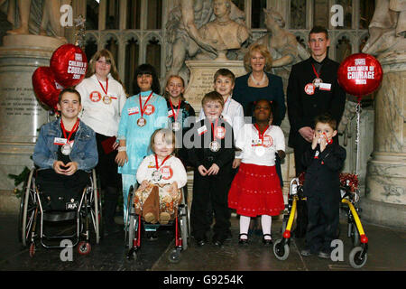 The Duchess of Cornwall with the Woman's Own Children of Courage award winners at Westminster Abbey, central London, on Wednesday December 14, 2005. (L-r, back row): Megan Marsh Whitworth, Ayeesha Javaid, Bianca Saunders, Callum Chapman, the Duchess of Cornwall, Mathew Harvey, (l-r, front): Jordan Bright, Alice Moore, Cameron Small, Hannah Olateju and Matthew Johnson. See PA Story ROYAL Courage. PRESS ASSOCIATION Photo. Photo credit should read: Chris Young/WPA/PA Stock Photo