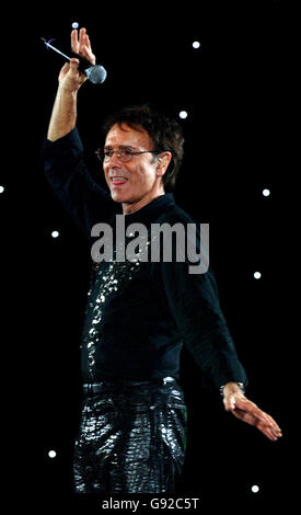 Sir Cliff Richard performs at the Cliff Richard Tennis Classic which is held at the National Indoor Arena in Birmingham, West Midlands. This is the final tennis Classic which cliff will hold. Stock Photo