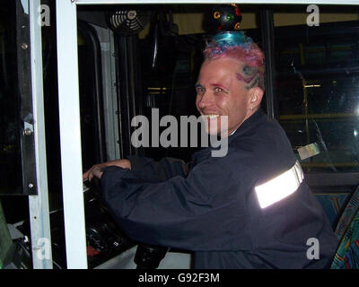 Bus driver Mark Davis, 31, who once sported a Christmas tree with lights on his head for a month has turned himself into a human disco to see in the New Year, Thursday December 29, 2005. Davis drew attention from around the world after hatching the plan to wear the tree day in, day out, woven into his hair, to raise funds for a local hospice. Now he plans to raise even more cash with a new hairstyle which he said is his craziest yet - by attaching a flashing and spinning disco ball to his head. See PA story SOCIAL Disco. PRESS ASSOCIATION Photo. Photo credit should read: Laura May/PA Stock Photo