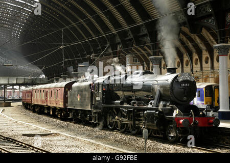 LMS Stanier class 8F steam locomotive 48151 at York station, UK with the Scarborough Spa Express charter train. Stock Photo