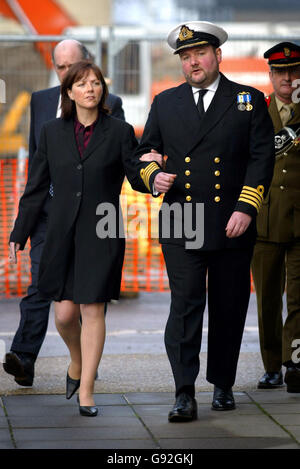 Royal Navy Captain Robert Tarrant arrives at HMS Nelson in Portsmouth with his wife Tracy McClure Monday 9 January, 2006. The submarine captain berated his subordinates with such rage that his face became 'gorged' with blood, a court martial heard. Captain Tarrant, 44, denied four charges of ill-treating officers under his command through repeated, unjustified, verbal abuse, and a fifth charge against a rating. See PA story COURTS Submarine. PRESS ASSOCIATION Photo. Photo credit should read: Chris Ison/PA Stock Photo