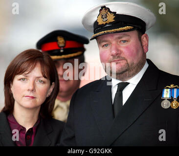 Royal Navy Captain Robert Tarrant arrives at HMS Nelson in Portsmouth with his wife Tracy McClure Monday 9 January, 2006. The submarine captain berated his subordinates with such rage that his face became 'gorged' with blood, a court martial heard. Captain Tarrant, 44, denied four charges of ill-treating officers under his command through repeated, unjustified, verbal abuse, and a fifth charge against a rating. See PA story COURTS Submarine. PRESS ASSOCIATION Photo. Photo credit should read: Chris Ison/PA Stock Photo