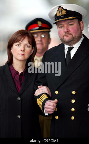 Royal Navy Captain Robert Tarrant arrives at HMS Nelson in Portsmouth with his wife Tracy McClure Monday 9 January, 2006. The submarine captain berated his subordinates with such rage that his face became 'gorged' with blood, a court martial heard. Captain Tarrant, 44, denied four charges of ill-treating officers under his command through repeated, unjustified, verbal abuse, and a fifth charge against a rating. See PA story COURTS Submarine. PRESS ASSOCIATION Photo. Photo credit should read: Chris Ison/PA Stock Photo