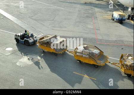 Loading an airplane at Kuala Lumpur airport Stock Photo