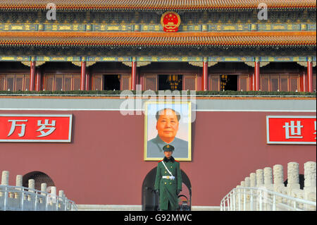 BEIJING,DECEMBER 8, 2011; Forbidden City as seen from Tiananmen Square with Mao mural and guard Stock Photo