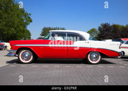 Side view of a parked red and white 1956 Chevrolet Belair 4-door hardtop Stock Photo