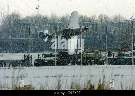 A Spitfire which is one of the static displays at the Eden Camp near Malton, Yorkshire is covered by snow Wednesday December 28, 2005. The camp features Second World War memorabilia. Snow and freezing temperatures greeted Britons struggling back to work today after the Christmas break. Kent and the east of England got the worst of the freezing conditions which led to road closures and train cancellations. Motoring organisations warned of treacherous road surfaces, while weather forecasters predicted an even colder day tomorrow. See PA story WEATHER Snow. PRESS ASSOCIATION Photo. Photo credit Stock Photo