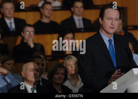 Former Conservative Party leader Iain Duncan Smith (left) watches as the current leader David Cameron makes a speech at the Centre for Social Justice in London, January 18, 2006. He committed his party to eradicating poverty and delivering social justice. Mr Cameron said that deprived estates such as Manchester's Moss Side and Glasgow's Easterhouse must be as important to the Tories as the leafy suburbs and villages from which they have traditionally drawn support. See PA story POLITICS Tories. PRESS ASSOCIATION Photo. Photo credit should read: Stefan Rousseau Stock Photo