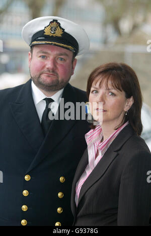 Royal Navy captain Robert Tarrant leaves HMS Nelson in Portsmouth with his wife Tracy McClure, Thursday January 19, 2005 after being cleared of three charges of ill-treating two officers and a rating through repeated, unjustified, verbal abuse. See PA story COURTS Submarine. PRESS ASSOCIATION Photo. Photo credit should read: Chris Ison/PA. Stock Photo