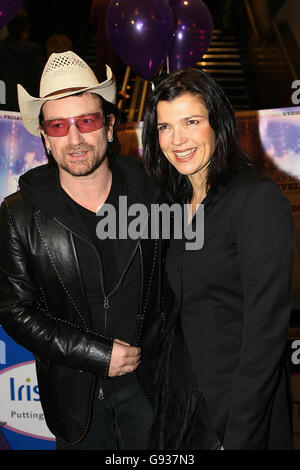 Bono, lead singer with Irish rock group U2 and his wife Ali Hewson, at the Irish Premiere of Neil Jordan's film 'Breakfast on Pluto' at The Savoy Cinema on O' Connell Street, Dublin Wednesday January 11 2006. PRESS ASSOCIATION Photo. Photo credit should read: Julien Behal/PA Stock Photo