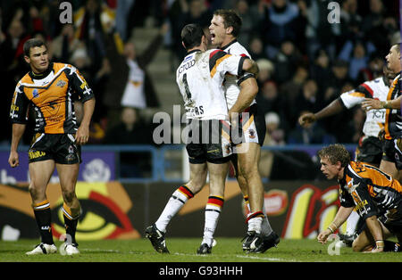 Bradford Bulls' Stuart Fielden (centre right) celebrates his try against West Tigers with team-mate Michael Withers, during the Carnegie World Club Challenge at the Galpharm Stadium, Huddersfield, Friday February 3, 2006. PRESS ASSOCIATION Photo. Photo credit should read: Gareth Copley/PA. **EDITORIAL USE ONLY** Stock Photo