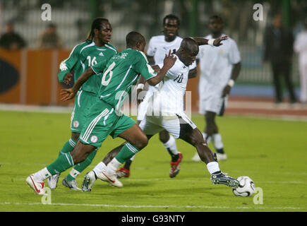 Nigeria's Joseph Enakarhie and Ghana's Stephen Appiah battle for the ball Stock Photo