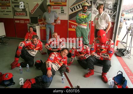 Formula One Motor Racing - Hungarian Grand Prix. Williams mechanics watch the race on television Stock Photo