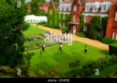 Photographers prepare for the students official graduation photographs on the lawn at Newnham College, Cambridge University Stock Photo