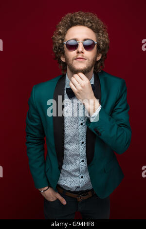 Portrait of stylish man in elegant clothes and sunglasses Stock Photo